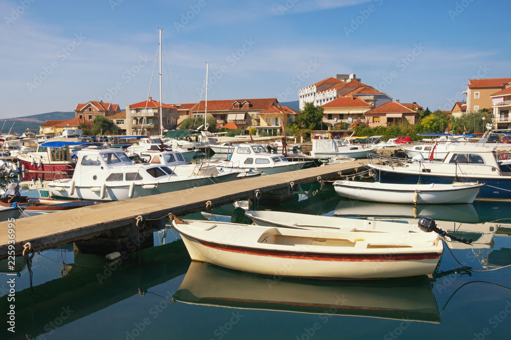 Fishing boats in harbor.  Montenegro, view of Tivat city and  Marina Kalimanj