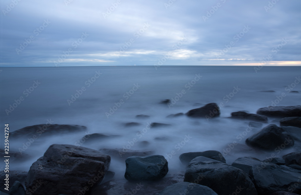 Long exposure of pacific ocean water on rocks