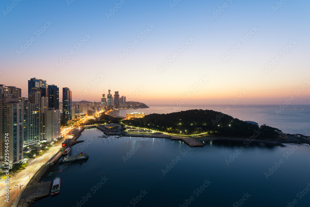 Sunrise at Haeundae beach in Busan. Haeundae beach is Busan's most popular beach in South Korea.