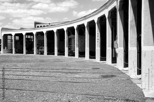 Old railroad roundhouse in black and white photo