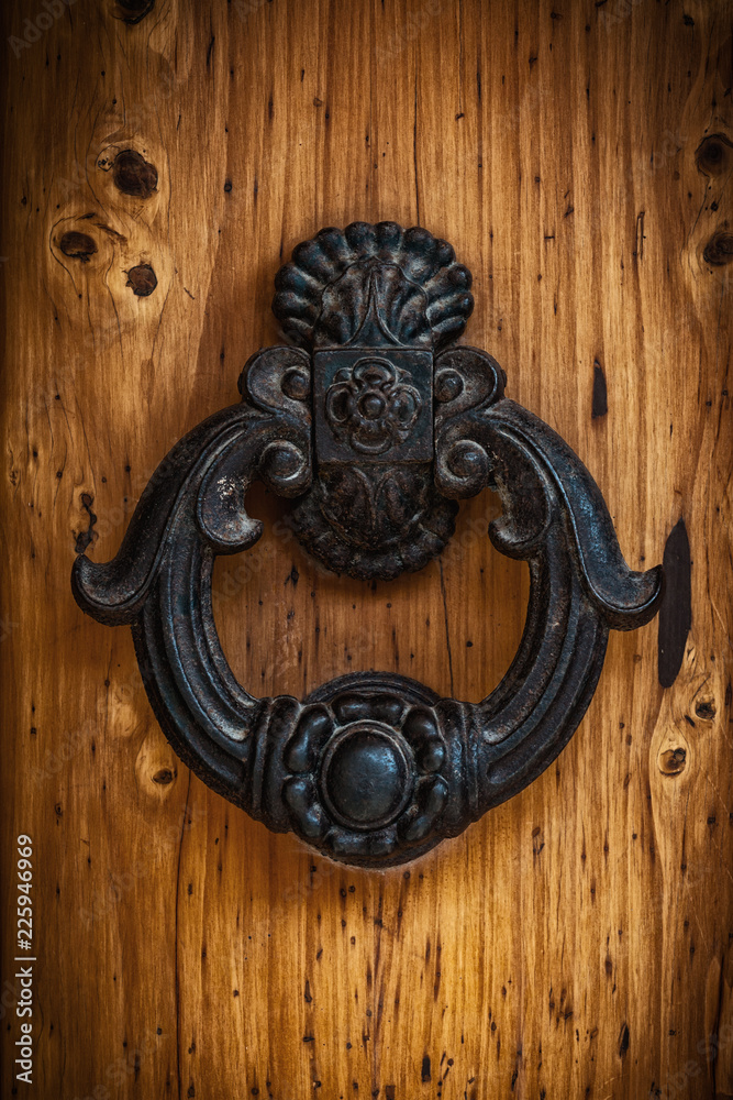Antique handle of a solid wood door. Antique handle of a solid wood door.