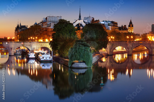 Ile de la Cite and Pont Neuf at sunrise in Paris, France, as seen from Pont des Arts © Kavalenkava