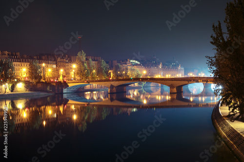 Seine, Pont du Carrousel and Orsay Museum at night in Paris, France