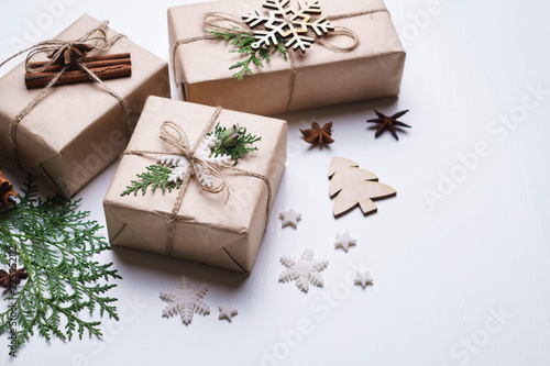 Christmas and New Year celebration atmosphere, holidays, surprise concept. Stylish decorated gift boxes composition on white background