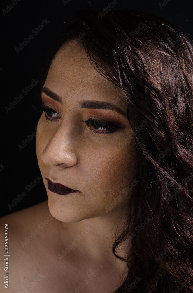Curly hair girl of dark color and makeup with dark tones. Curly hair girl of dark color and makeup with dark tones.