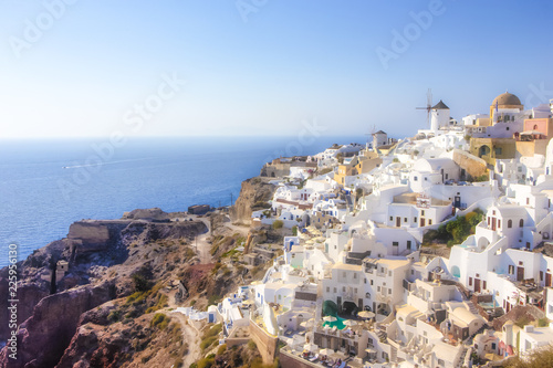 Amazing Picturesque Santorini Island in Greece. Wonderful Daylight Scenery with Traditional Greek White Architecture. Located in Oia Village and Ochre Domed Church.