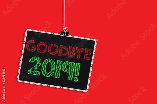 Handwriting text writing Goodbye 2019. Concept meaning New Year Eve Milestone Last Month Celebration Transition Hanging blackboard message communication information sign red background photo