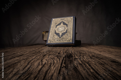 Koran - holy book of Muslims ( public item of all muslims ) on the table , still life