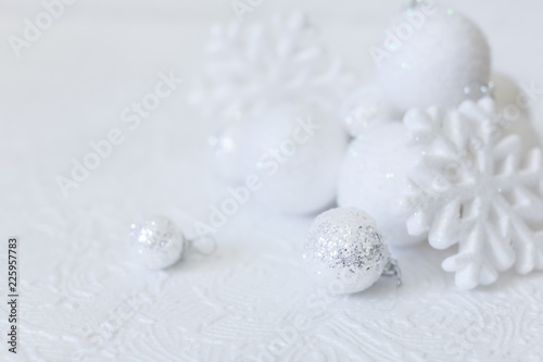 Christmas or new year composition. Christmas decorations in silver and white colors with balls and snowflake