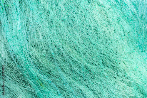 Fishing net textured pattern over the sand in a beach at Cobquecura, Chile, an amazing traditional pattern of the meshing ropes making the fishing net