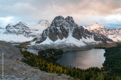 Cerulean lake is glowing orange at sunset in Assiniboine Provincial Park photo