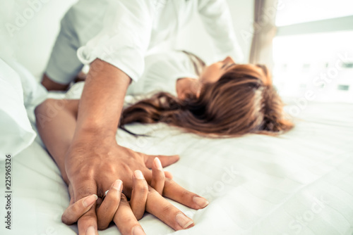 Romantic love of young couple in the bedroom.