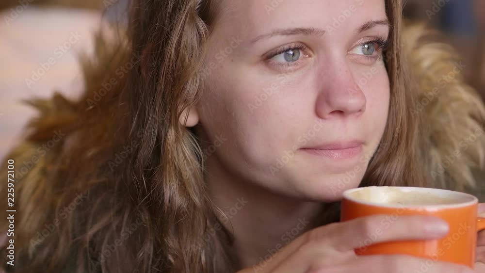 Girl drinks a cup of coffee Girl drinks a cup of coffee