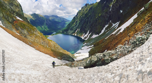 Fototapeta Naklejka Na Ścianę i Meble -  Morskie Oko. High Tatras, Poland, May 27, 2018. Beautiful landscape of snowy mountain tops and the lake between them.