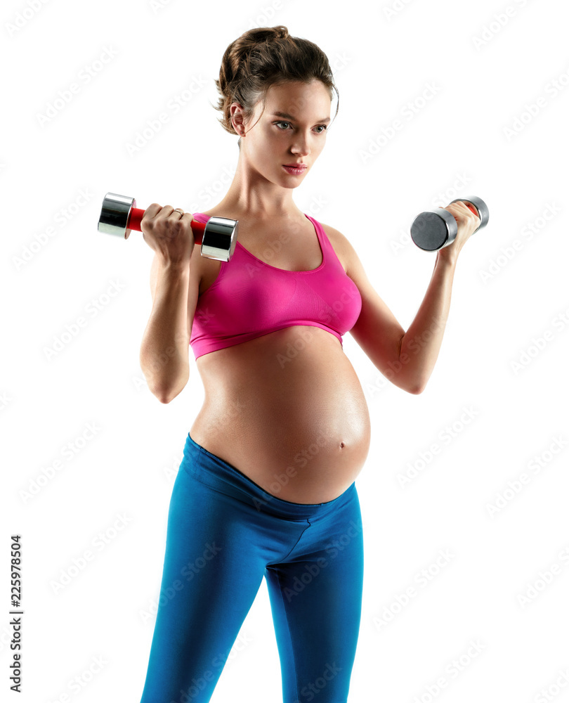 Sporty pregnant woman doing exercises with dumbbells isolated on white background. Concept of healthy life Sporty pregnant woman doing exercises with dumbbells isolated on white background. Concept of healthy life