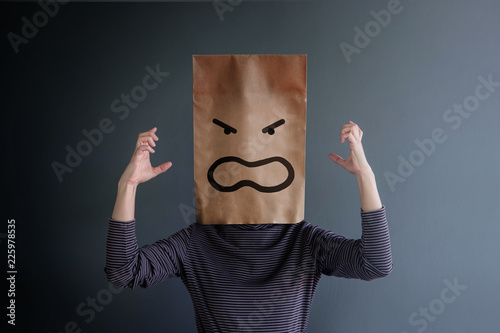 Customer Experience or Human Emotional Concept. Woman Covered her Face by Paper Bag and present Angry Feeling by Drawn Line Cartoon and Body Language photo