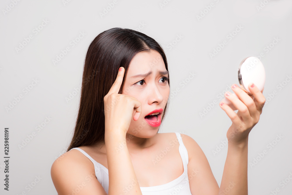 Young asian woman look unhappy with her hair Young asian woman look unhappy with her hair