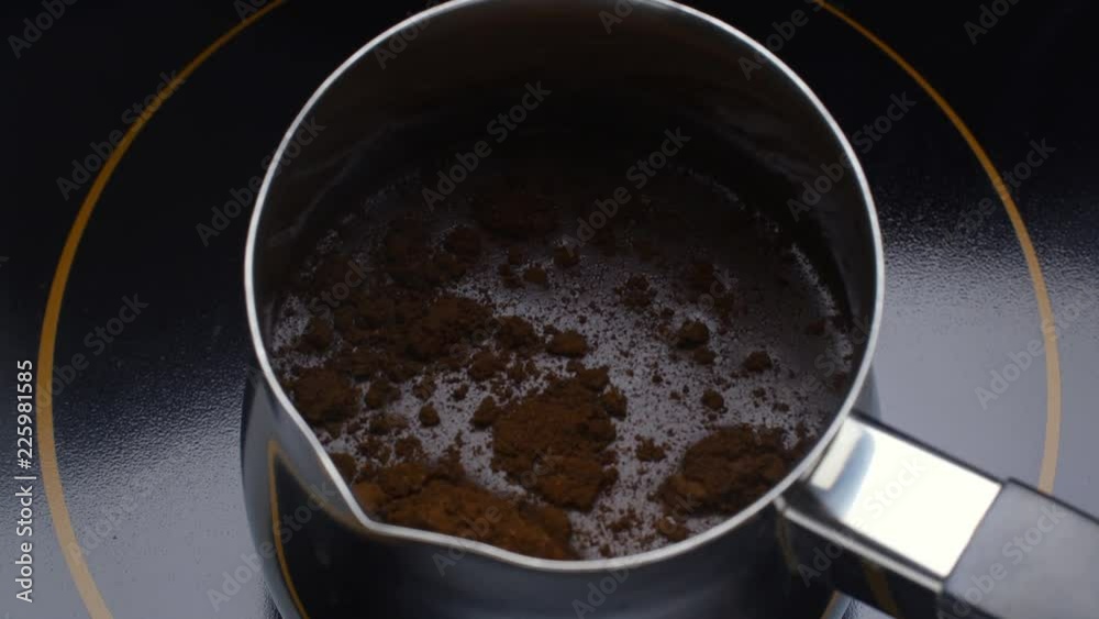 Preparation of turkish coffee. Coffee pot on cooking plate.
Preparation of turkish coffee. Coffee pot on cooking plate.