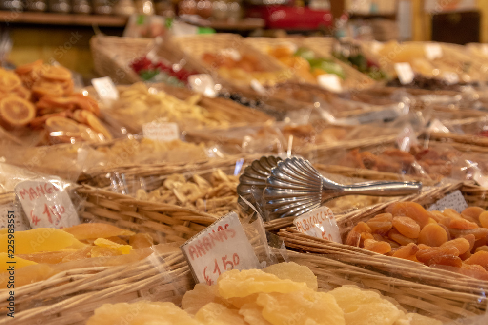Fototapeta premium colorful fresh dried fruits and vegitables lined up and sold in food market in italy