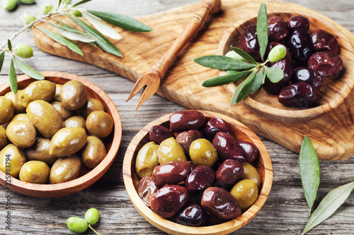 Bowls with different marinated olives. Healthy snack or appetizer.