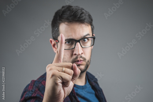 Fotografie Scolding gesture, pointing with the finger