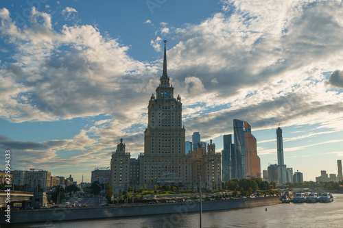 Moscow city image at the sunset. One of the Stalin era houses image (Ukraine hotel) and Moscow City (modern business buildings)