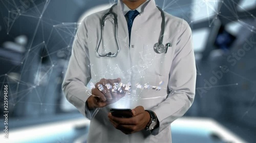 TENOFOVIR ALAFENAMIDE FUMARATE - Male Doctor With Mobile Phone Opens and Touches Hologram Active Ingrident of Medicine photo