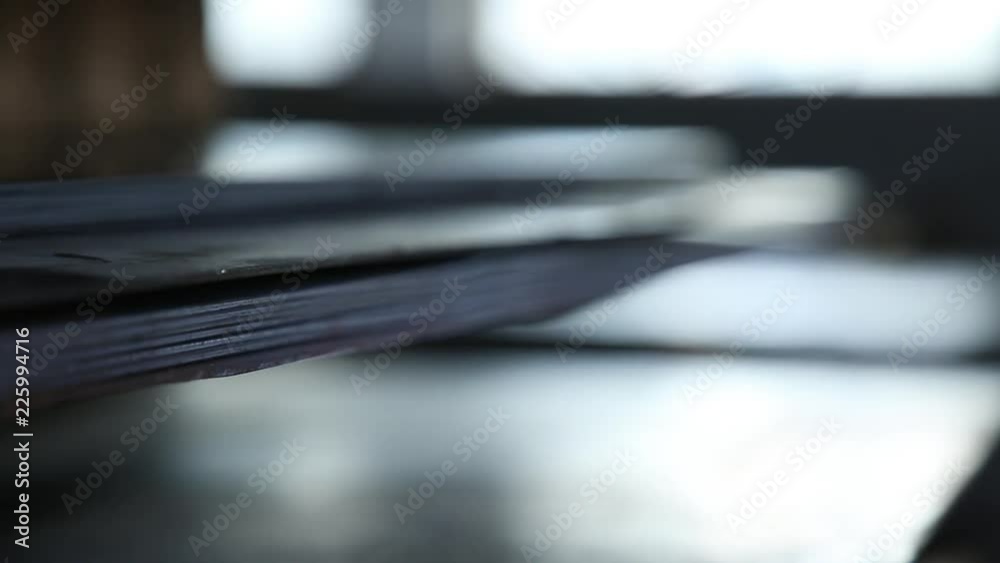 Metal sheets. Are put by a low pile. Metal sheets are put by a pile. It is removed through refocus. Sheets are removed in section. Color of sheets steel.