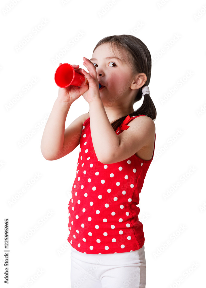 preschool girl plays on a toy trumpet isolated preschool girl plays on a toy trumpet isolated