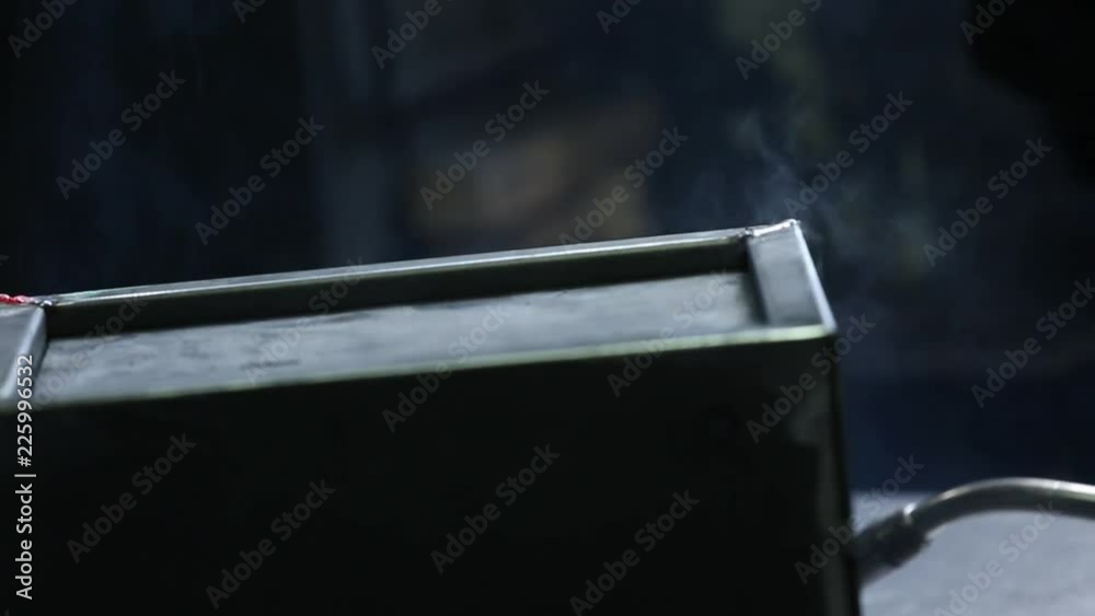 Welding of the safe. Electric welding of the safe. Sparks fly. Working room. Natural lighting. Welding of the safe. Electric welding of the safe. Sparks fly. Working room. Natural lighting.
