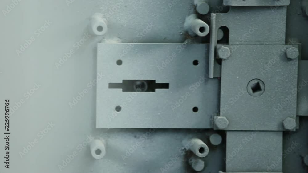 Locking mechanism of the safe. Locking mechanism of the safe. Partially installed in a door. Completely it isn't collected yet. It is painted. Close up. Locking mechanism of the safe. Locking mechanism of the safe. Partially installed in a door. Completely it isn't collected yet. It is painted. Close up.