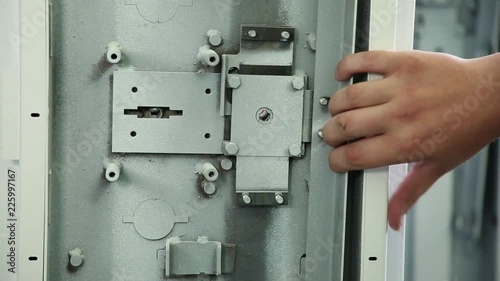 Locking mechanism of the safe. Check of the locking mechanism of the safe. The mechanism is checked for closing opening. Large shot.