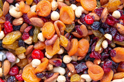 Dried fruits with nuts. Cashew, hazelnuts, peanuts, dried apricots, viburnum, raisins. © Oleg