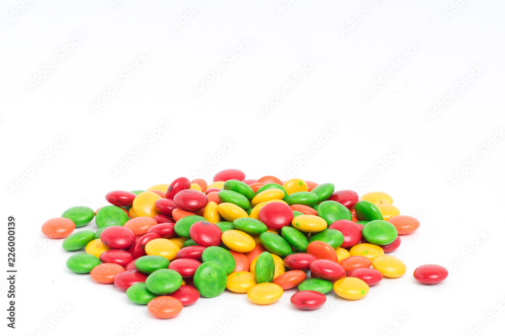 Creative arrangement of colorful candies and sweets on white background Creative arrangement of colorful candies and sweets on white background