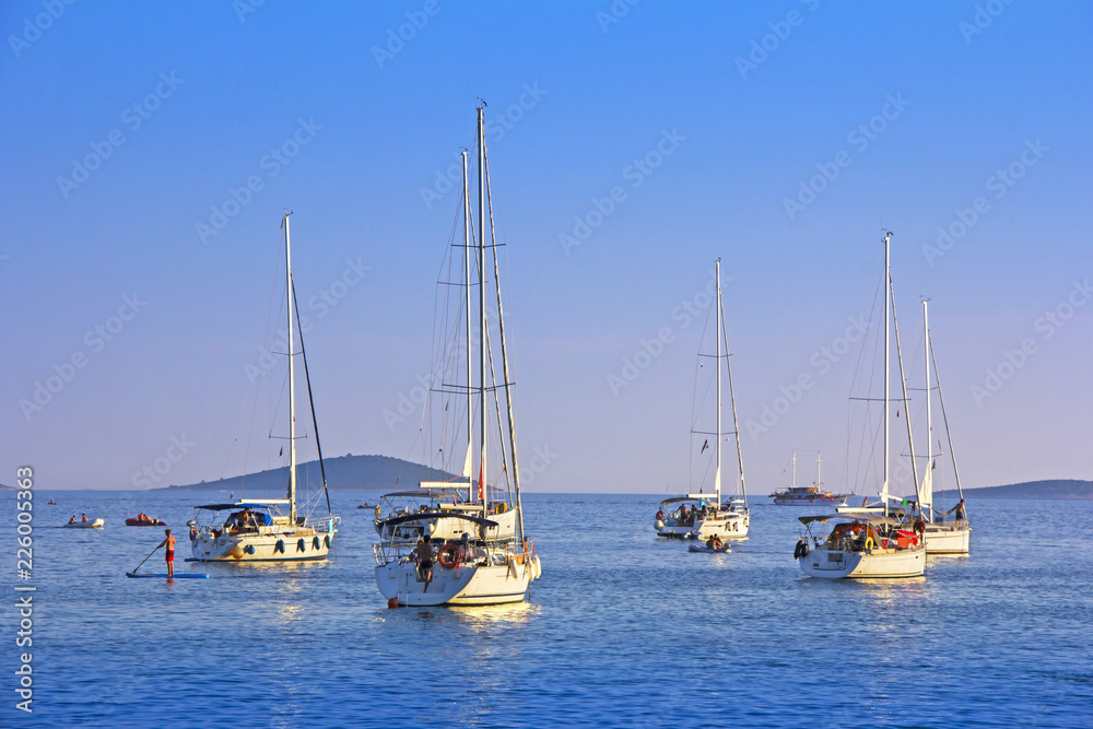 Anchored sailing boats in the bay on island Murter, Croatia