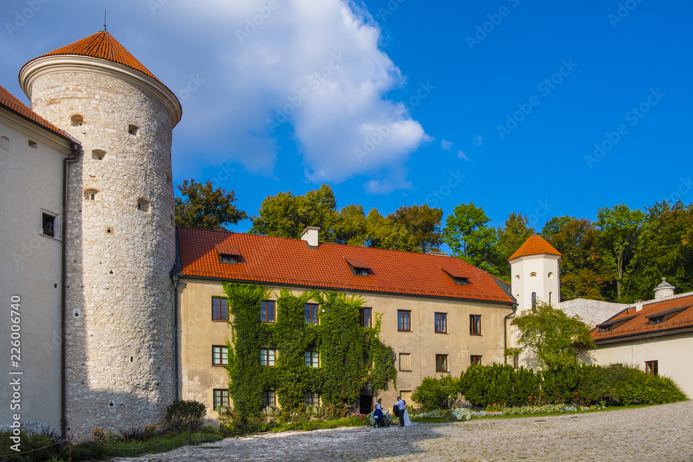 Pieskowa Skala, Poland - Inner courtyard and gothic tower of historic castle Pieskowa Skala by the Pradnik river in the Ojcowski National Park