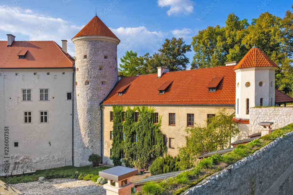 Pieskowa Skala, Poland - Inner courtyard and gothic tower of historic castle Pieskowa Skala by the Pradnik river in the Ojcowski National Park