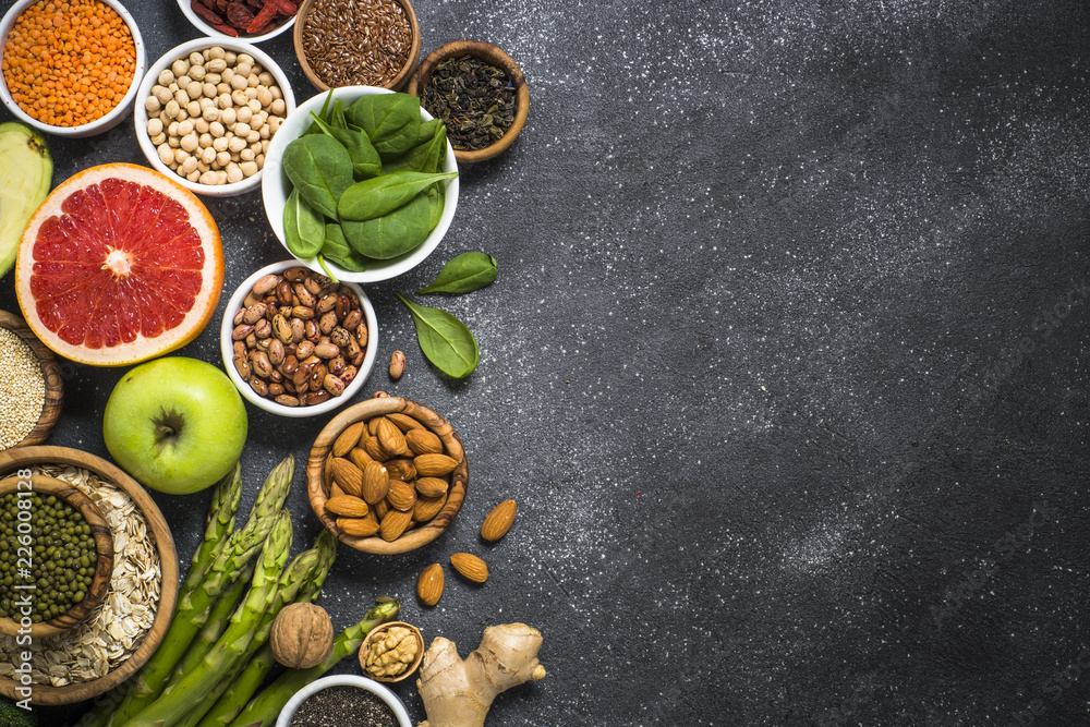 Superfoods on black stone background. Superfoods on black stone background.
