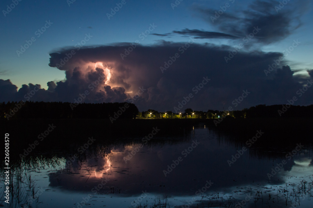 Thunderstorm cloud early in the morning, in summer before sunrise