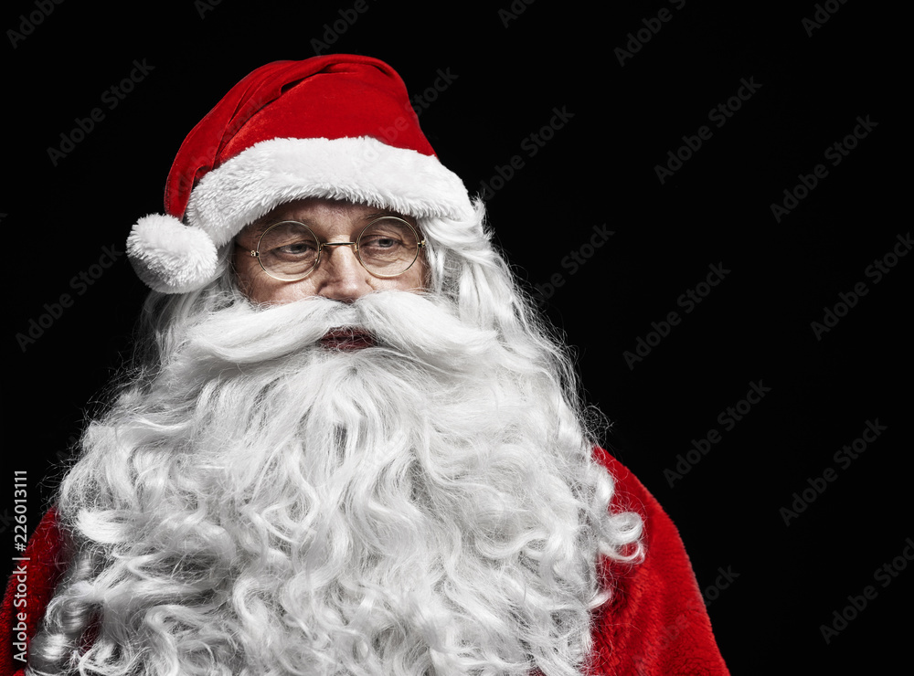 Sad and worried santa claus at studio shot .