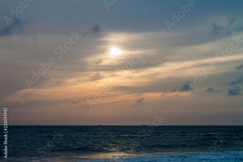 Sun  clouds and a sea