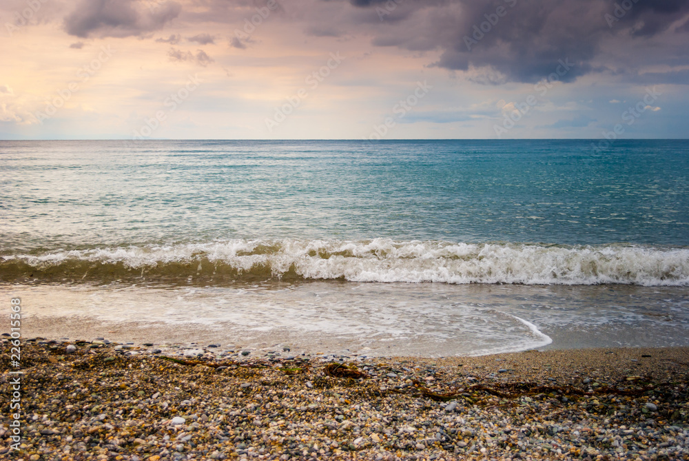 The sea shore, with blue sky and clouds and clear sea The sea shore, with blue sky and clouds and clear sea