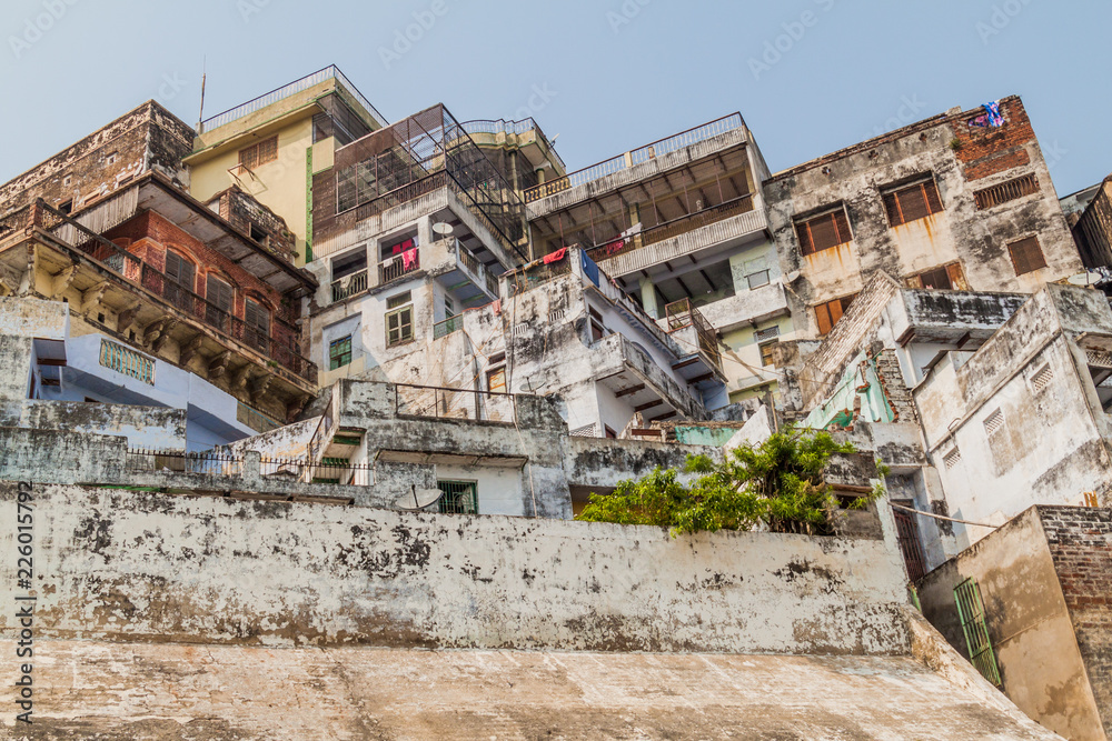 Buildings at a Ghat (riverfront steps) of sacred river Ganges in Varanasi, India