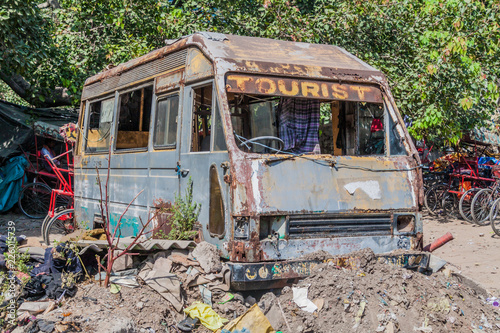 Old rusty bus in the center of Delhi, India.