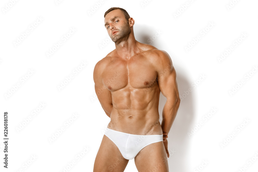 Strong stripped muscle male model in white underwear on white