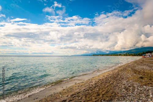 The sea shore  with blue sky and clouds and clear sea