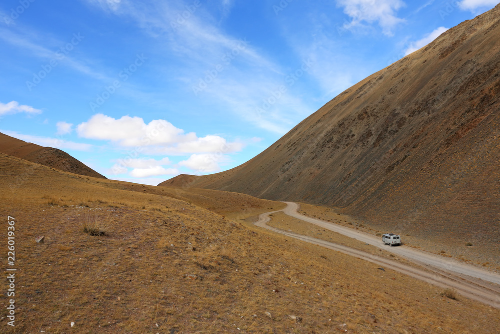 Path of car on rural roads in the desert mountain of the Western Mongolia