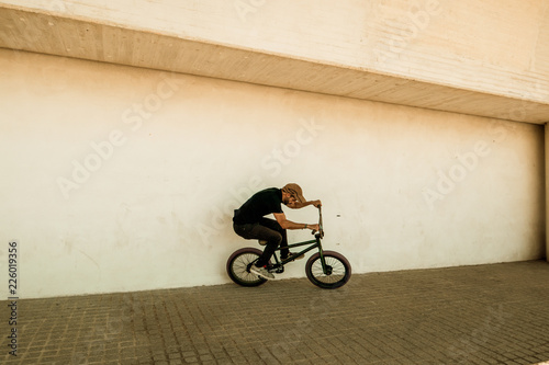 Guy riding a bmx bike.