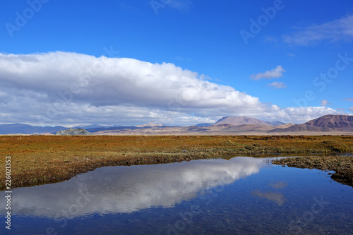 Autumn Landscape of reflection of the river near the village in Western Mongolia