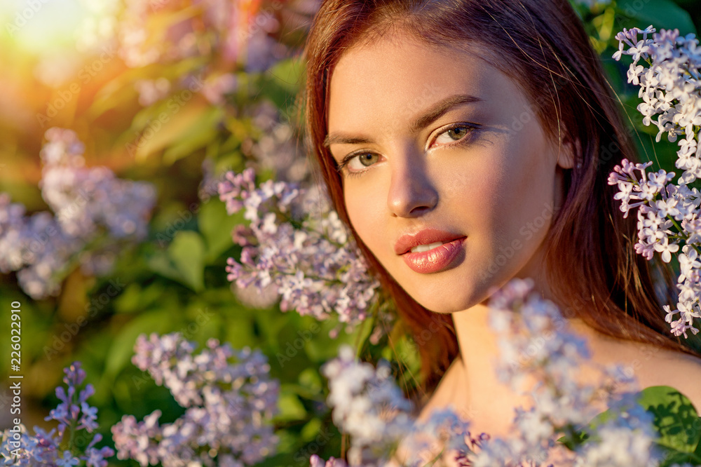 Pretty young woman posing outdoors in nature.